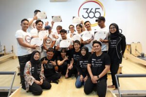 group-pilates-instructors-exercising-reformers 11